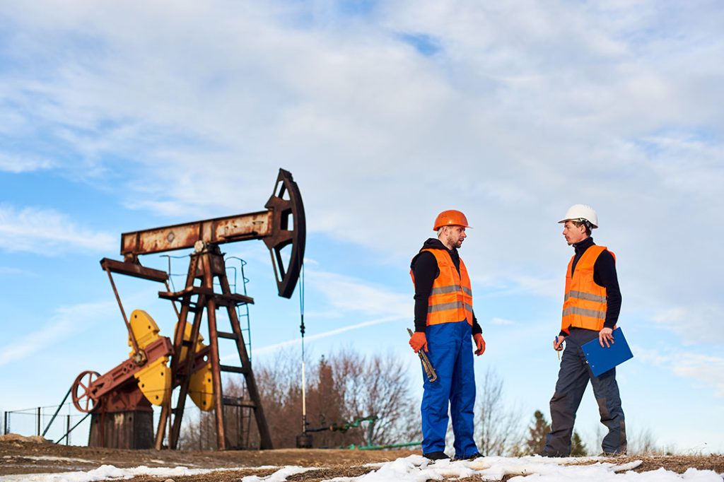 petroleum operators talking oil field